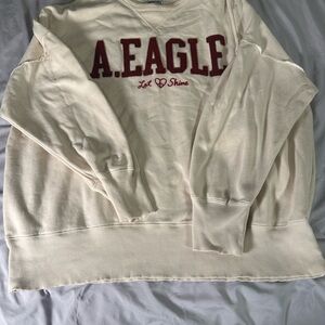 American Eagle Cream Sweatshirt with Red Logo